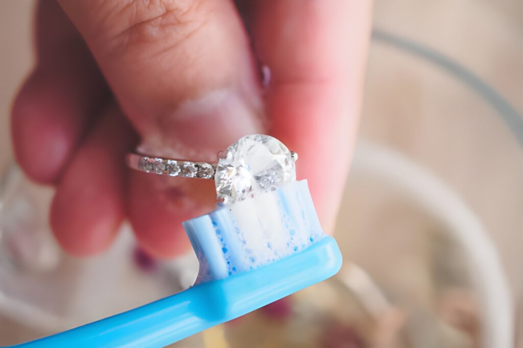 Gently clean your diamond jewellery using a soft toothbrush and mild soap to restore its natural sparkle.